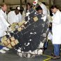 KSC workers examine a large piece of Columbia debris. NASA photo.