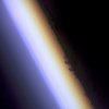 Earth's limb -- the edge of the planet seen at twilight -- was captured by a STS-100 crewmember aboard Space Shuttle Endeavour. Near the center of the frame, the silhouette of cloud layers can be seen in the atmosphere, above which lies an airglow layer (left). NASA photo.