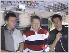 From left are Expedition One crewmembers Yuri Gidzenko, Bill Shepherd and Sergei Krikalev. With their increment complete, they are now onboard Space Shuttle Discovery for the ride back to Earth after undocking from the International Space Station. NASA image.