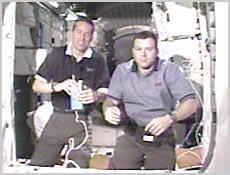 STS-102 Commander Jim Wetherbee and Pilot Jim Kelly answer questions during an interview inside the station's Unity Module. NASA image.