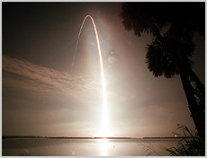 Like a sun on a fast rise, Space Shuttle Atlantis arcs into the still-black sky over the Atlantic Ocean, casting a fiery glow on its way. Atlantis lifted off from Launch Pad 39B on time at 4:04 a.m. CDT (09:04 GMT) Thursday to begin STS-104. NASA photo.