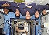 NASA photo of five STS-98 astronauts floating upside-down in orbit