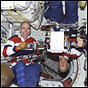 NASA image of STS-105 Mission Specialists Dan Barry, left, and Pat Forrester.