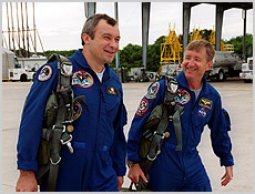 Expedition Three Pilot Vladimir Dezhurov (left) and Commander Frank Culbertson walk to their T-38 jets for a training flight. NASA photo.