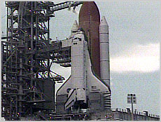 Space Shuttle Discovery sits on Launch Pad 39A after NASA officials postpone STS-105's launch. Discovery is now slated to lift off at 4:15 p.m. CDT (21:15 GMT) Friday. NASA image.