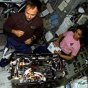 STS-107 Payload Specialist Ilan Ramon, left, and Mission Specialist Kalpana Chawla work with the Combustion Module-2 in the SPACEHAB Research Double Module aboard Space Shuttle Columbia. NASA image.