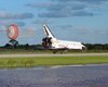 NASA photo of a space shuttle landing with drag chute
