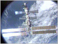 This image was taken through the centerline camera of Endeavour's Orbiter Dcking System. The International Space Station flies over the Atlantic Ocean in this NASA TV image. 