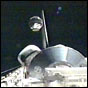 In this NASA image, the STARSHINE 2 satellite is released from the Shuttle's payload bay.