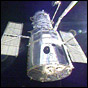 NASA image of The Hubble Space Telescope being released from the cargo bay using the Shuttle's robotic arm.