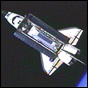 NASA TV image of Space Shuttle Atlantis approaching the ISS. The S0 Truss can be seen in the open payload bay.