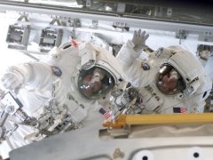 NASA photo of astronauts Smith and Walheim during the third spacewalk.