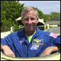 STS-111 Commander Ken Cockrell aboard an M-113 Armored Personnel Carrier during countdown rehearsal. The tank-like vehicle would be used in the event of a fire or explosion hazard at the pad. NASA photo.