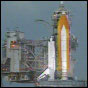 Space Shuttle Endeavour sits on Launch Pad 39A just after flight controllers decided to postpone liftoff for 24 hours due to thunderstorms and anvil clouds in the vicinity. NASA image.