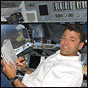 STS-112 Commander Jeff Ashby on the flight deck of Atlantis. NASA photo.
