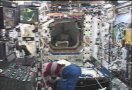 STS-112 Mission Specialist Sandy Magnus works in the ISS. NASA TV capture.