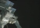 Piers Sellers enters the airlock after he and David Wolf completed work outside the International Space Station. NASA TV capture.
