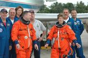At the Shuttle Landing Facility on NASA's Kennedy Space Center, STS-114 Pilot James Kelly and Mission Commander Eileen Collins join support personnel after completing practice runs on the Shuttle Training Aircraft (STA). NASA PHOTO NO: KSC-05PD-1477