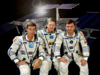 Seated from left to right are Expedition 1 crewmembers Sergei K. Krikalev, William M. Shepherd and Yuri P. Gidzenko in this crew photograph taken in front of a rendition of the International Space Station. Photo courtesy of NASA.