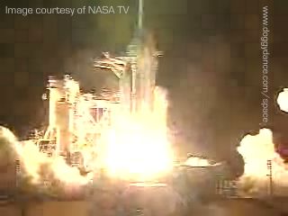 Discovery's engines have ignited and she is lifting away from the pad