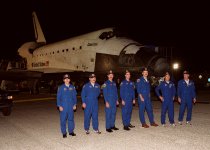 The STS-106 crew poses for a photograph after a successful mission and landing. Standing, left to right, are Mission Specialists Yuri I. Malenchenko, Boris V. Morukov, Daniel C. Burbank and Richard A. Mastracchio; Pilot Scott D. Altman; Mission Specialist Edward T. Lu; and Commander Terrence W. Wilcutt.  Main gear touchdown occurred on-time at 3:56:48 a.m. EDT.  Photo courtesy of NASA.