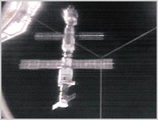 This view of the International Space Station comes from Atlantis' docking compartment. The station is now comprised of the Unity Module (top), the Russian Zarya Control Module (second from top) and the Zvezda Service Module. Also, at bottom, a Russian Progress cargo module is attached to the aft end of the newly arrived Zvezda. Photo courtesy NASA.