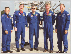 After their arrival at Kennedy Space Center, Fla., the STS-97 astronauts pose for a photo. From left, they are Mission Specialists Carlos Noriega, Joe Tanner and Marc Garneau, Commander Brent Jett and Pilot Mike Bloomfield. Image courtesy of NASA.