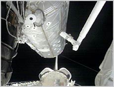 Space Shuttle Atlantis' robotic arm attaches the U.S. Laboratory Destiny to the International Space Station. NASA image.
