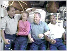STS-98 Astronauts (from left) Mark Polansky, Marsha Ivins, Thomas Jones and Robert Curbeam share a laugh during an interview with reporters on Earth. NASA image.